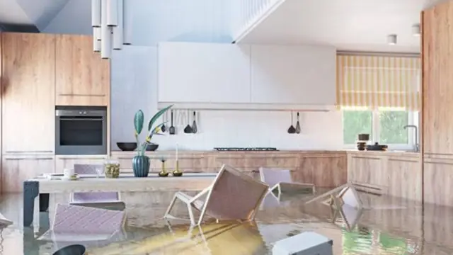 Modern kitchen with water standing on the floor